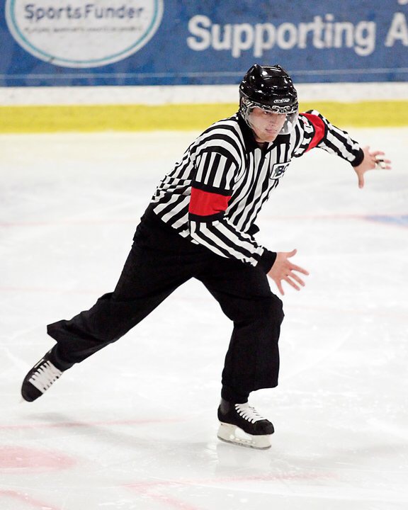 Steve Hunter refereeing a hockey game